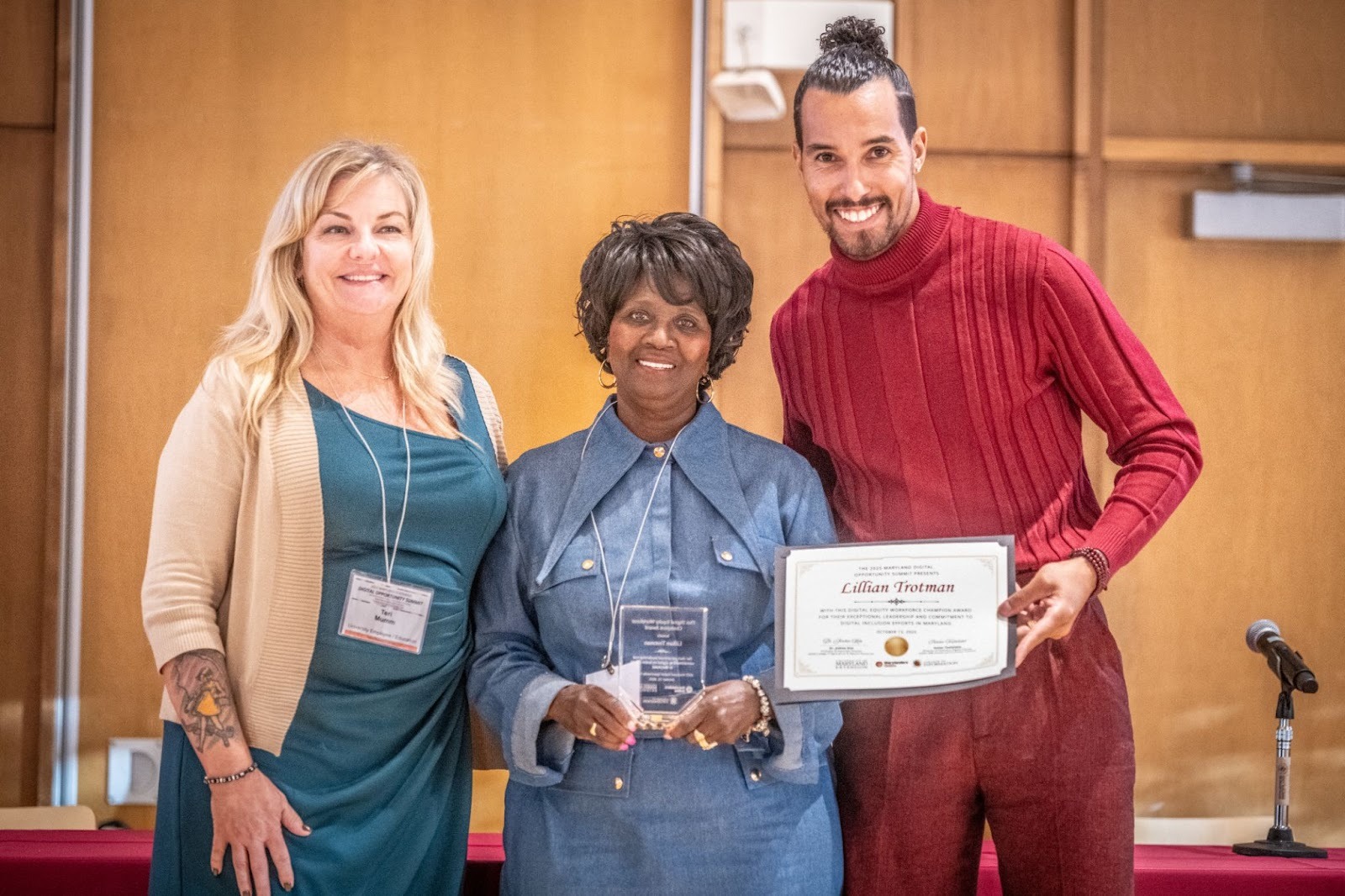 Pictured: Lillian “Lil” Trotman stands between Teri Mumm and Ronnie Hammond to accept her award.