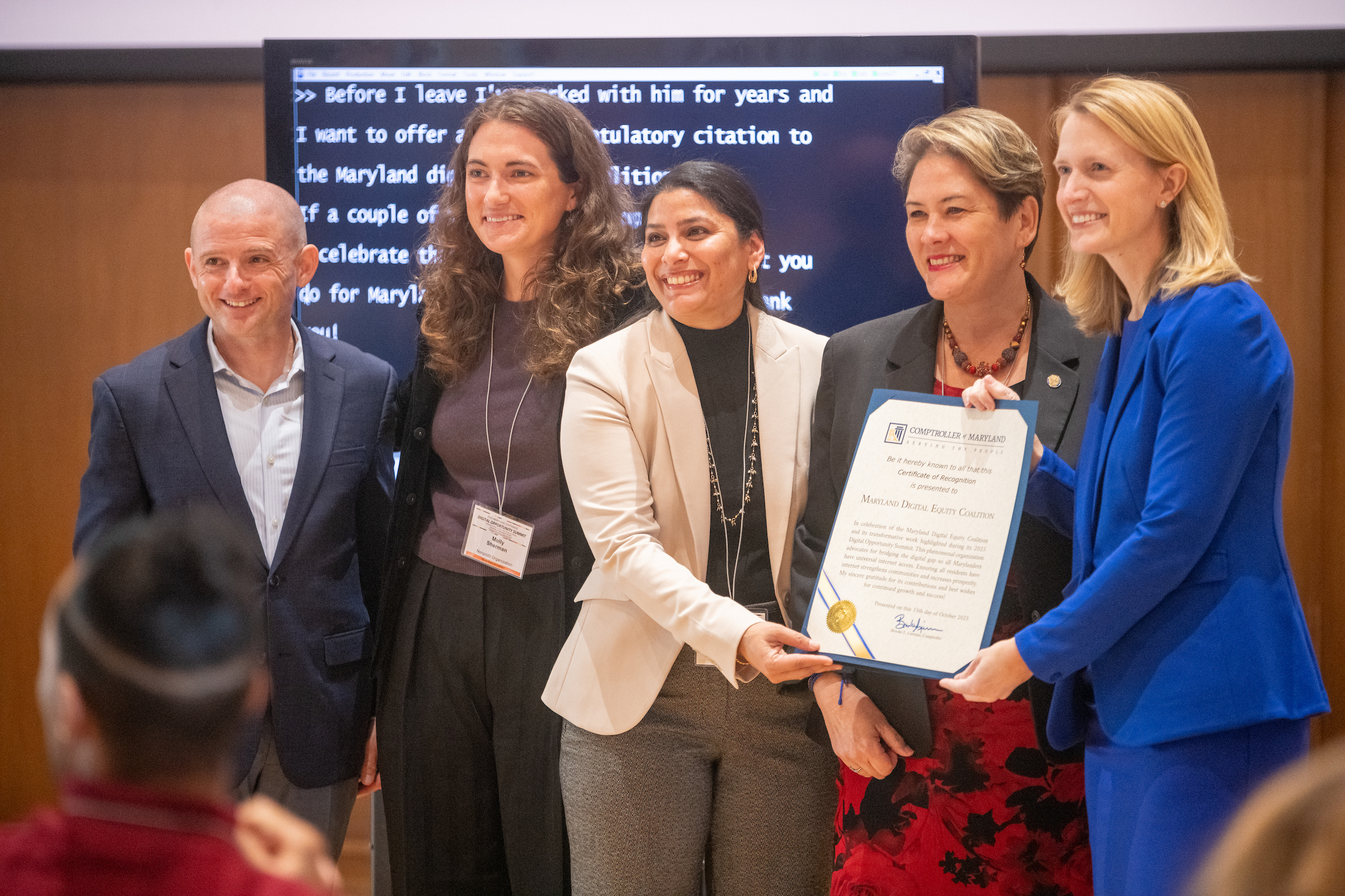  Josh Bokee, Molly Sherman, Vishnupriya Desai, Mistuko Herrera, and Brooke Lierman stand with a Digital Opportunity Citation. 