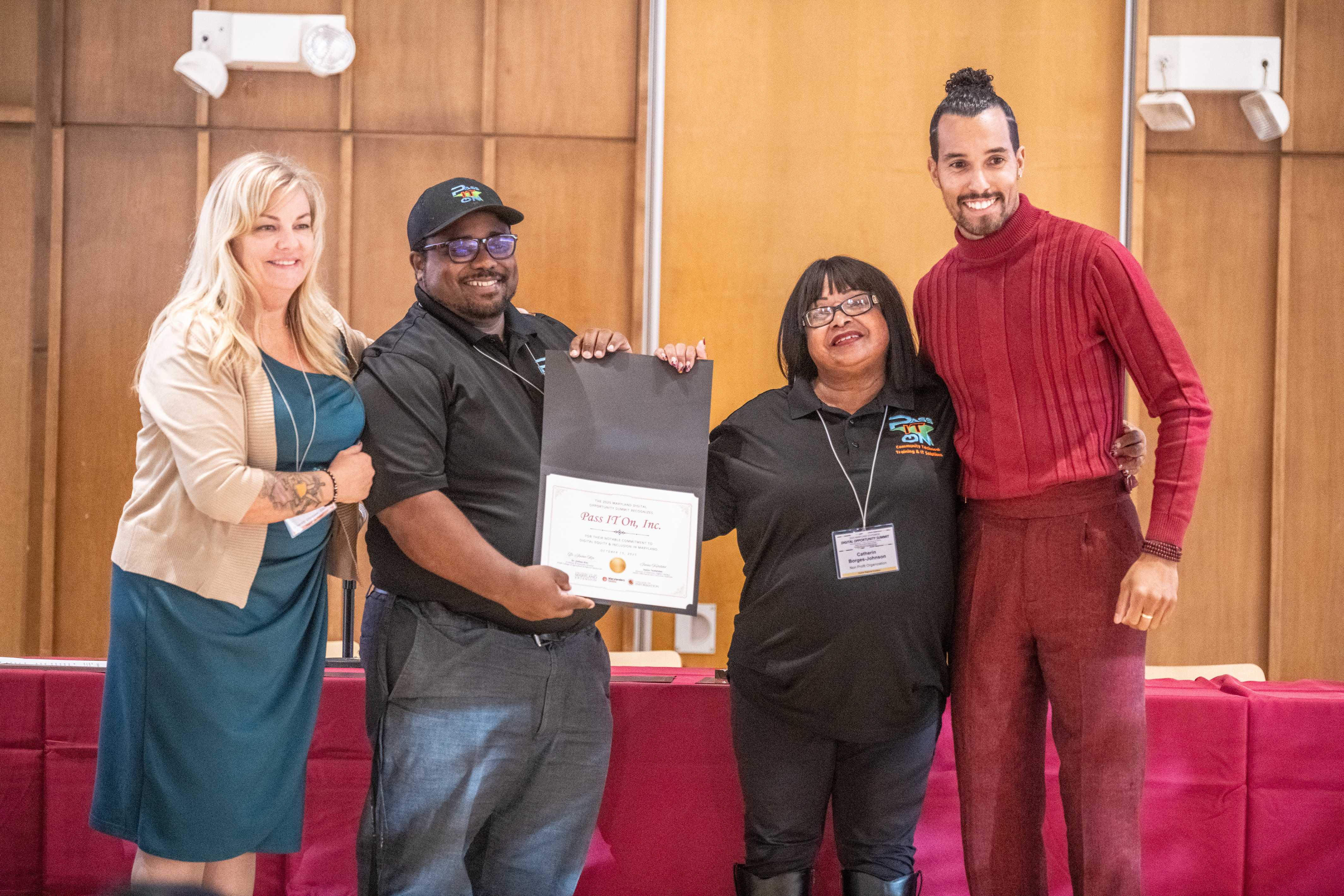 Pictured: Pass IT On, Inc. staff members accept the Workforce Notable Mention award on behalf of the organization.